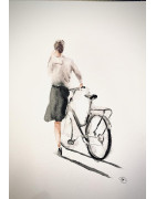 Cycliste poussant son vélo
